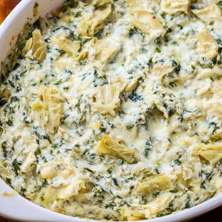This rich, creamy appetizer features tender green spinach and chopped artichoke hearts baked with mozzarella and Parmesan.