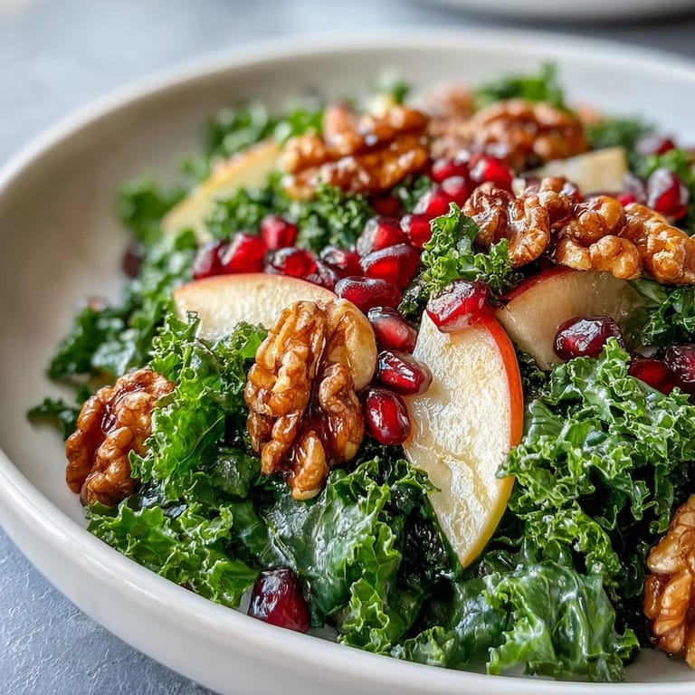 Gluten-free Kale and Pomegranate Bowl featuring tender greens, juicy fruit, and a sweet honey-maple dressing ready in fifteen minutes.
